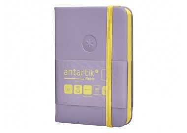 Cuaderno con gomilla antartik notes tapa dura a7 hojas lisas morado y amarillo 80 hojas 80 gr fsc
