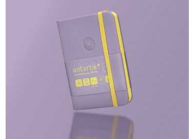 Cuaderno con gomilla antartik notes tapa dura a7 hojas lisas morado y amarillo 80 hojas 80 gr fsc