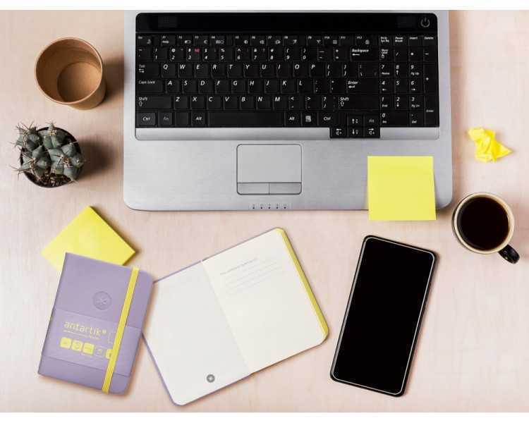 Cuaderno con gomilla antartik notes tapa dura a7 hojas lisas morado y amarillo 80 hojas 80 gr fsc