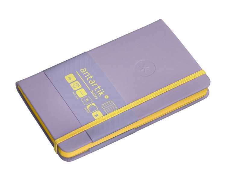 Cuaderno con gomilla antartik notes tapa dura a6 hojas cuadricula morado y amarillo 100 hojas 80 gr fsc