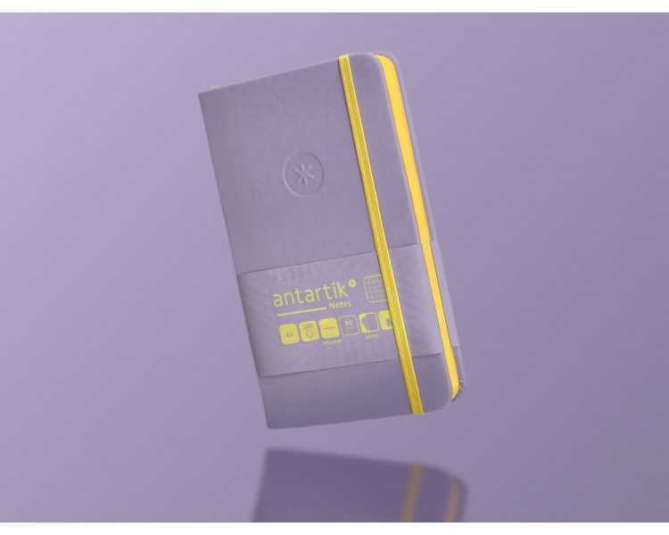 Cuaderno con gomilla antartik notes tapa dura a6 hojas cuadricula morado y amarillo 100 hojas 80 gr fsc